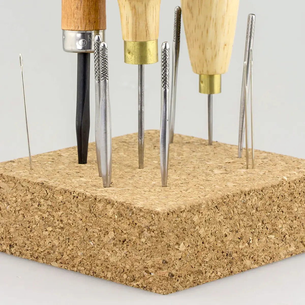 Ivan Cork Awl Block with leathercrafting tools.