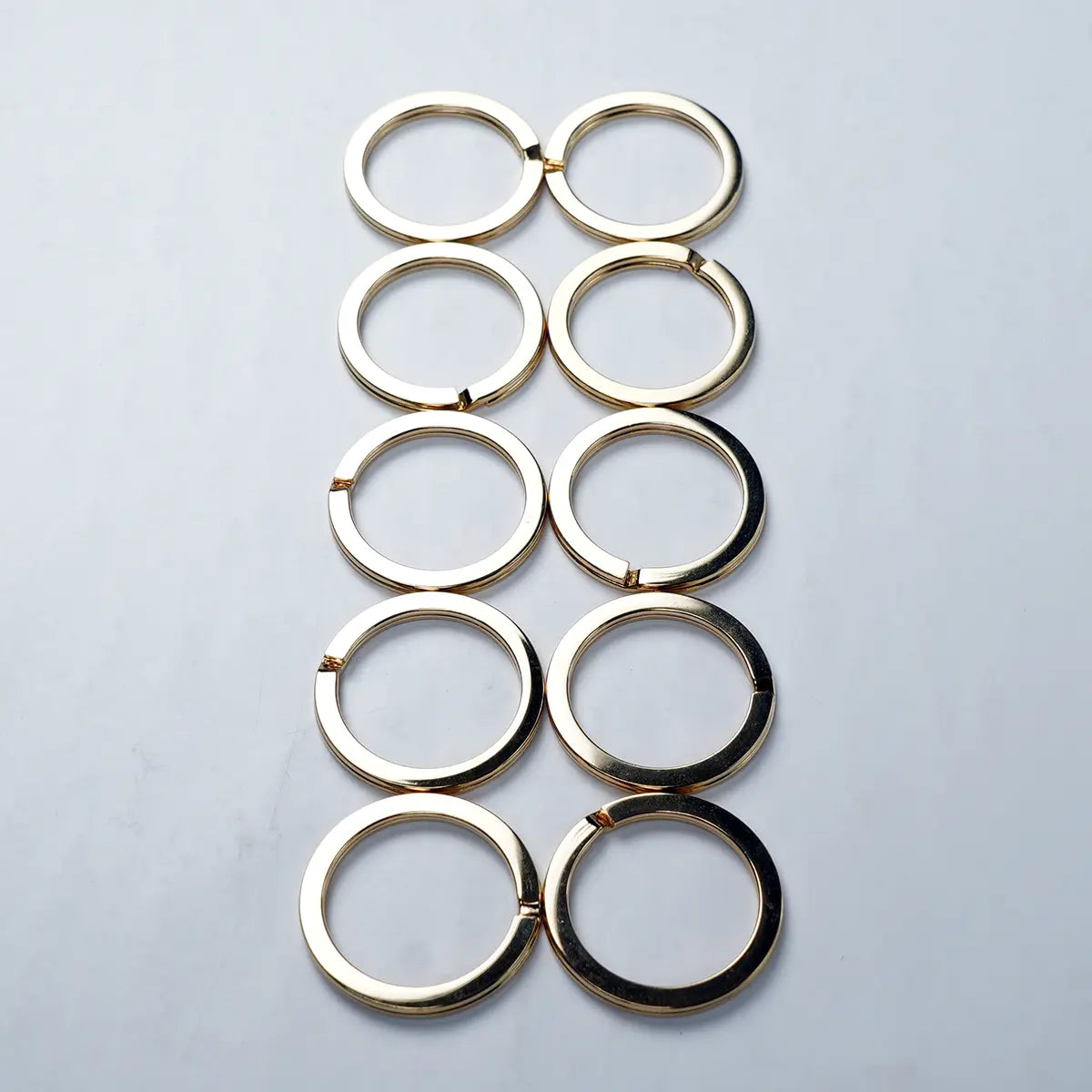 10 Pack of 1 Inch Gold Flat Keyrings.